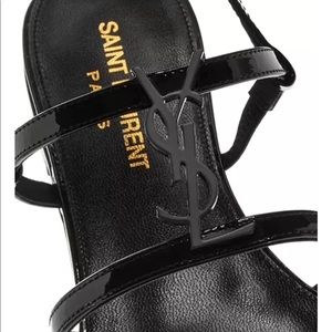 YSL Saint Laurent "Cassandra" patent leather
sandals.